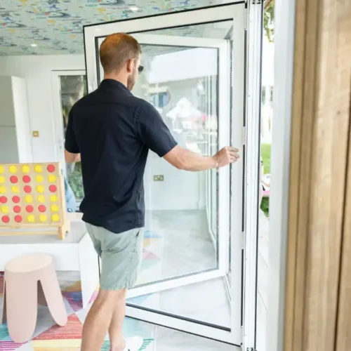 Tom opening bi-fold door at Coconuts Clubhouse