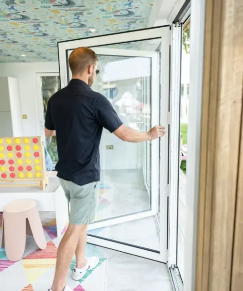 Tom opening bi-fold door at Coconuts Clubhouse