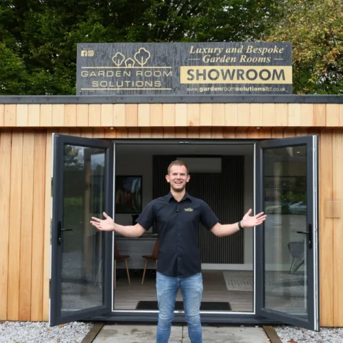 Tom Standing in Front of the Showroom