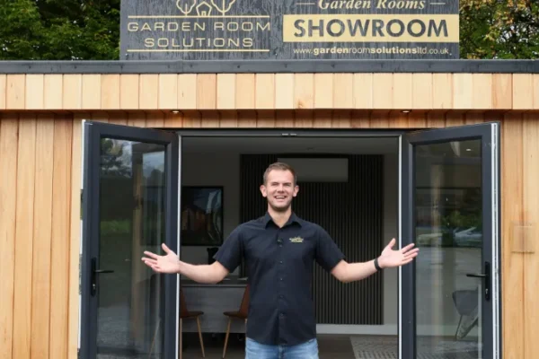 Tom Standing in Front of the Showroom