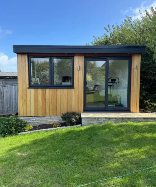 Garden Room with wooden cladding and upvc sliding door